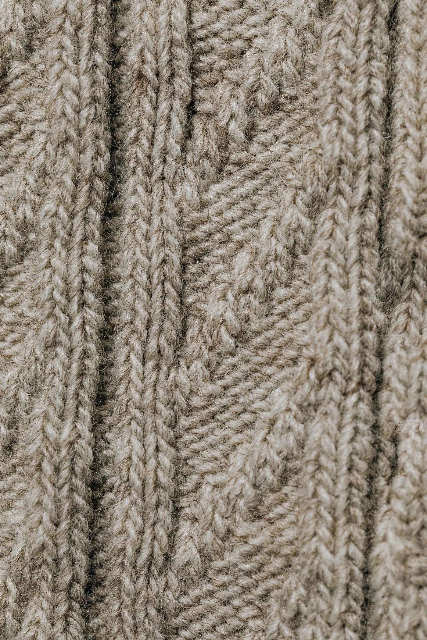 Heavy cable-knit wool, textured close-up